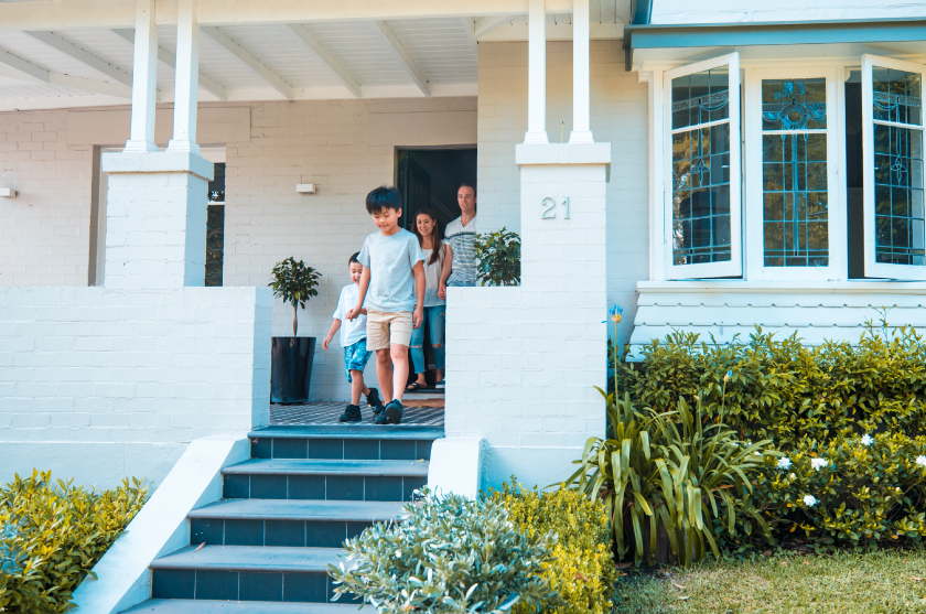 Children running outside home