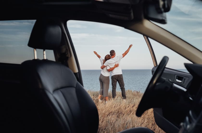 Couple outside car