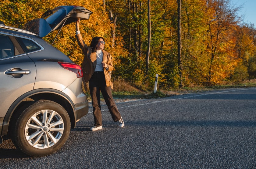 Young woman and SUV
