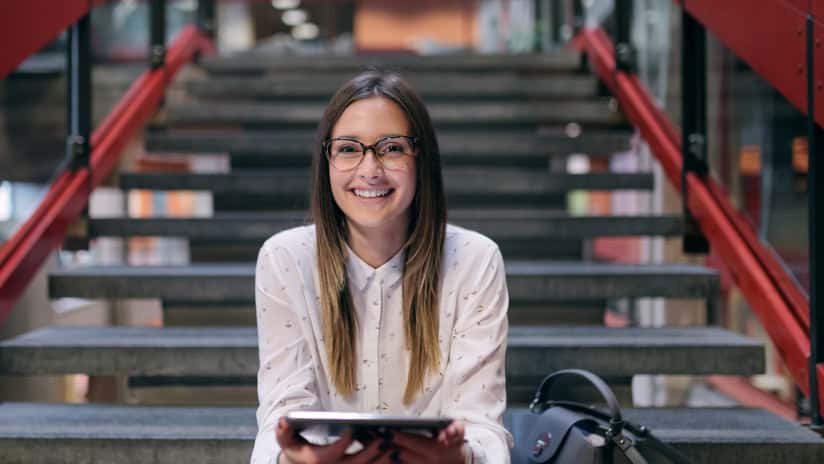College student sitting on stairs
