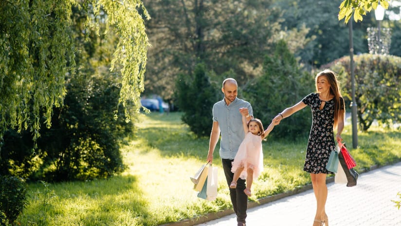Family walking through park