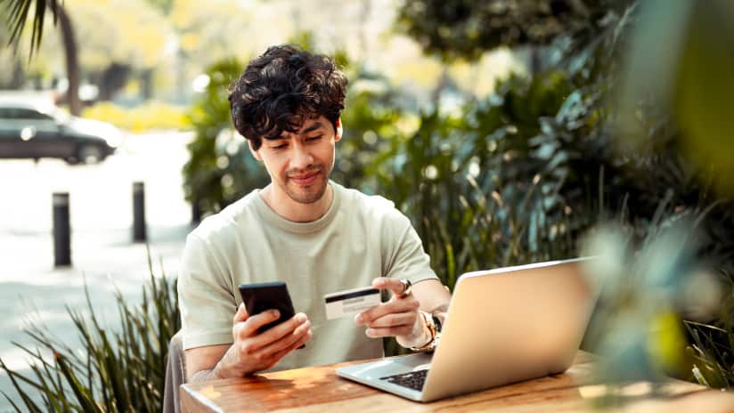 Young man paying bill