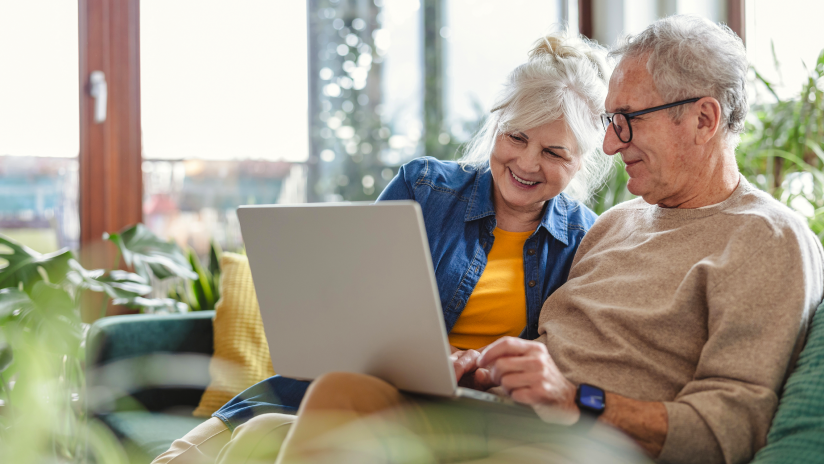man and woman looking at laptop