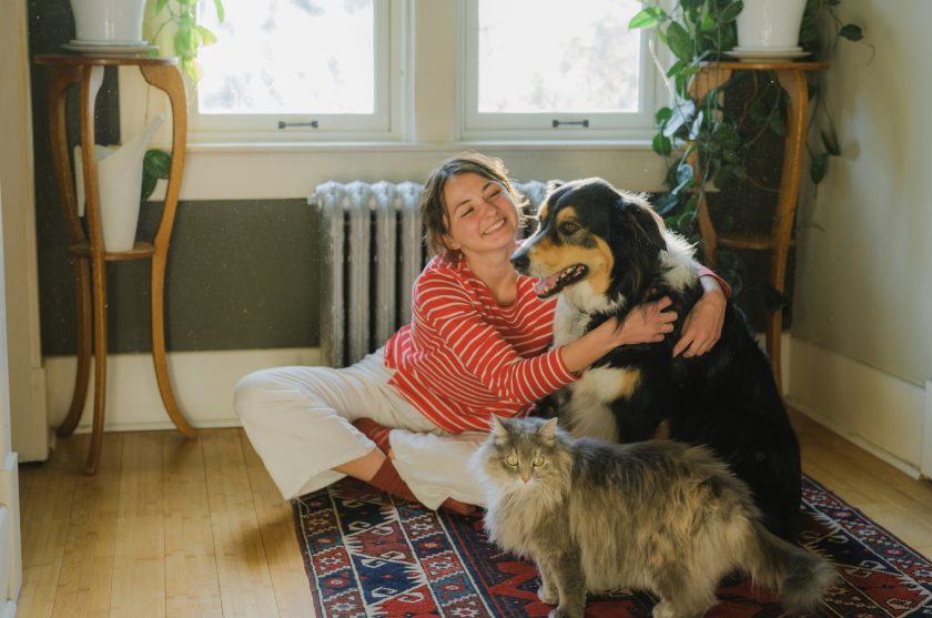 woman with dog in home