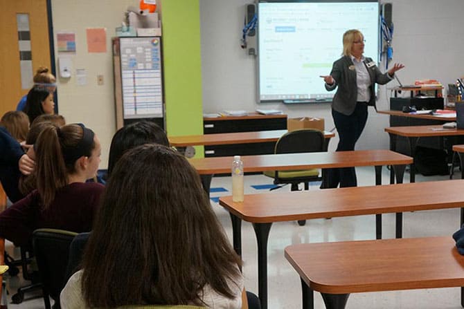 Karen Hoad teaching financial education workshop to high school students