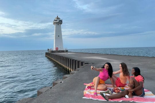 Girls on beach taking selfie